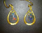 Gold Plated sterling Silver dangling pear shape earrings with two 7x5mm Opals